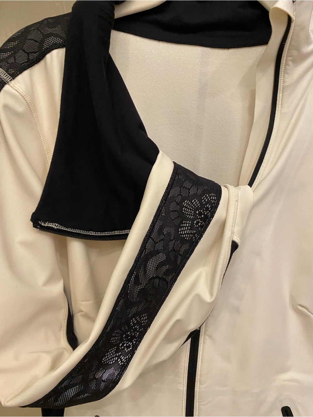 Vintage Lulemon Cream and Black jacket with Lace sleeve inserts.